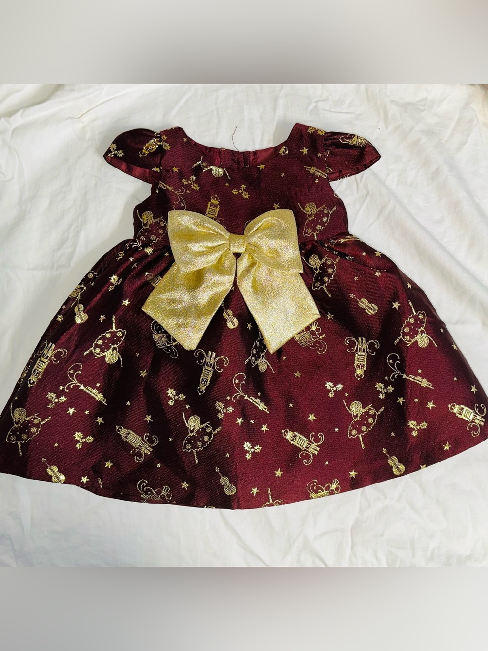 Bonnie Baby Burgundy and Gold Nutcracker Print Holiday Dress with Sparkle Bow
